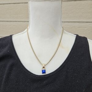 Avon gold tone chain necklace with blue square pendant signed SAQ